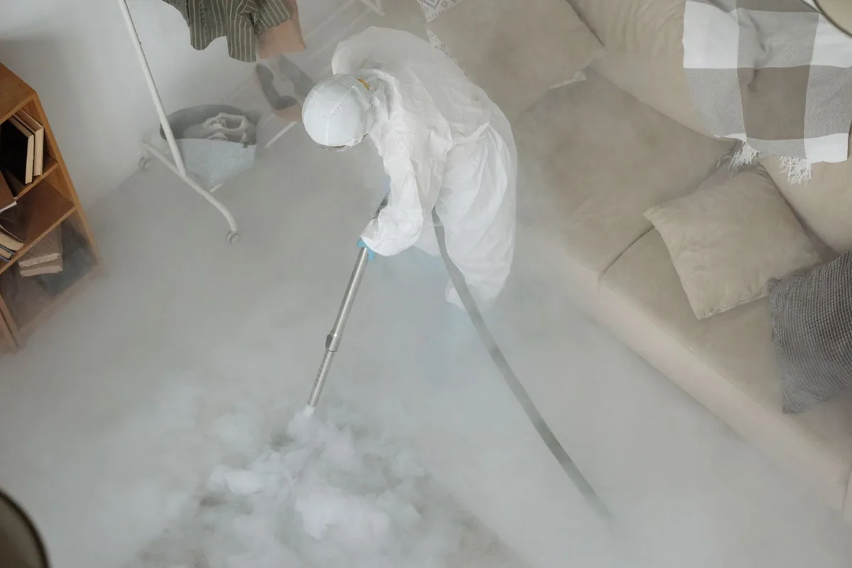 Biohazard cleanup technician in protective equipment, Lyons, GA